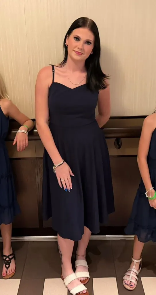 Anna Kepner in a navy dress.