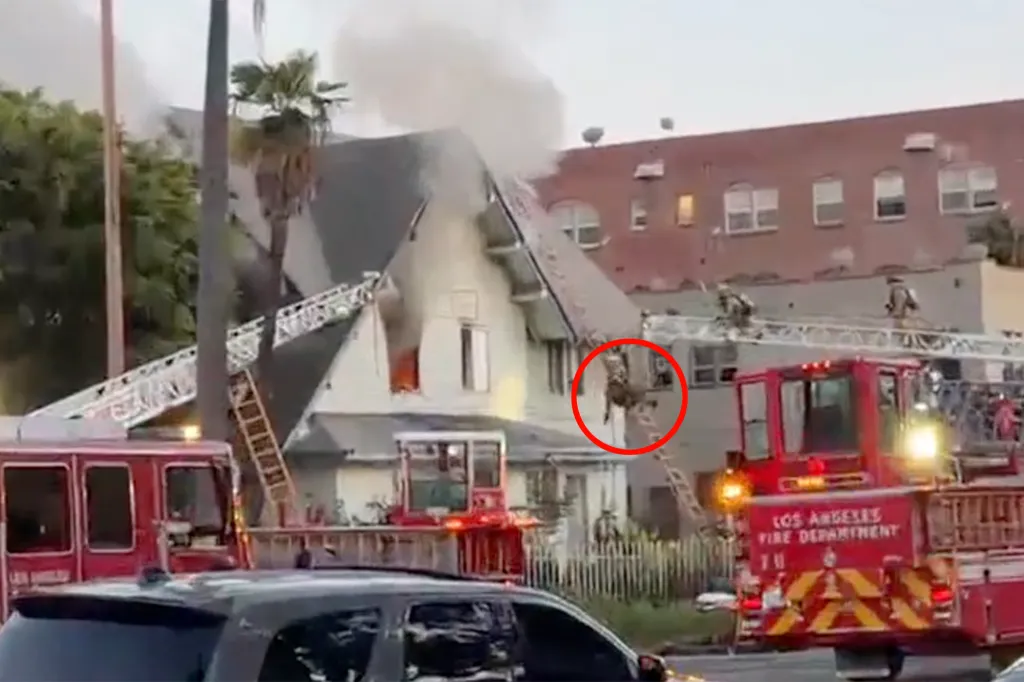 A firefighter falling from a ladder while battling a house fire in Arlington Heights, Los Angeles.