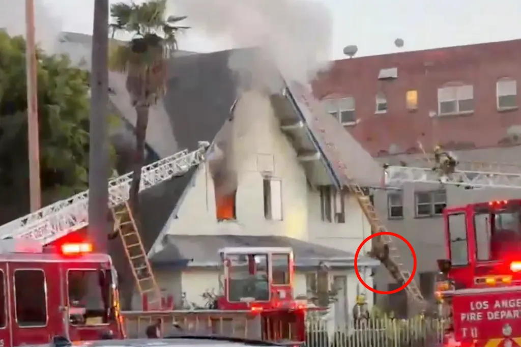 A firefighter falling from a ladder while battling a house fire in Arlington Heights, Los Angeles.