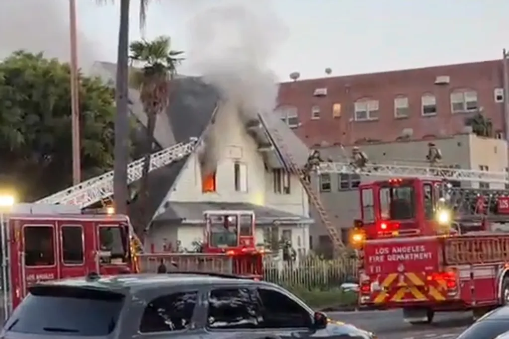 Firefighters battling a house fire in Arlington Heights, Los Angeles.