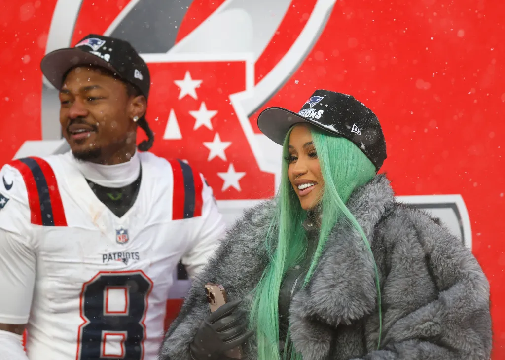 Artist Cardi B and Stefon Diggs #8 of the New England Patriots celebrate following the AFC Championship Playoff game against the Denver Broncos at Empower Field At Mile High on January 25, 2026 in Denver, Colorado. 
