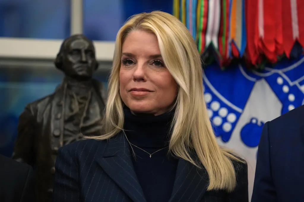 Pam Bondi listening to President Trump.