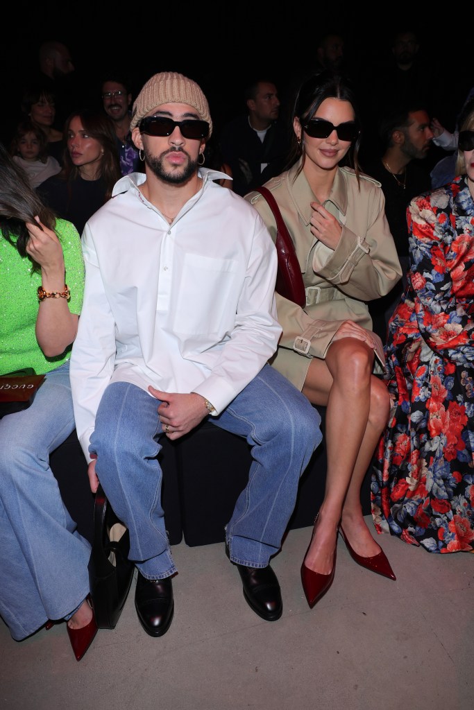Bad Bunny and Kendall Jenner sitting at the Gucci Ancora show during Milan Fashion Week.