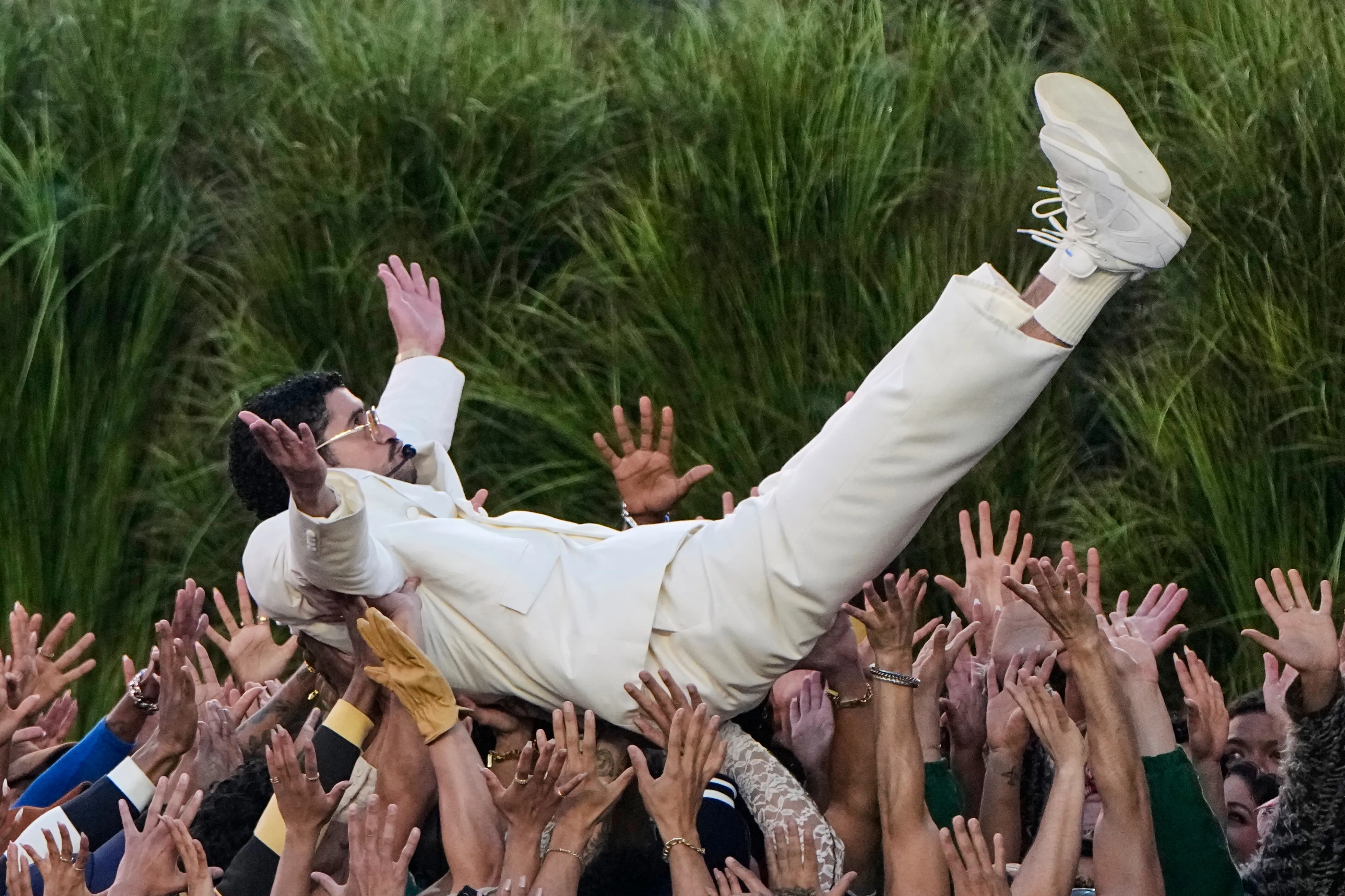 Bad Bunny crowd surfing during the Super Bowl LX halftime show.