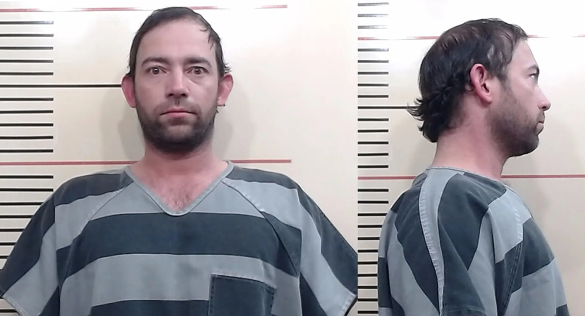 Mugshot of Adan Banuelos in a striped jumpsuit, facing forward and to the side.