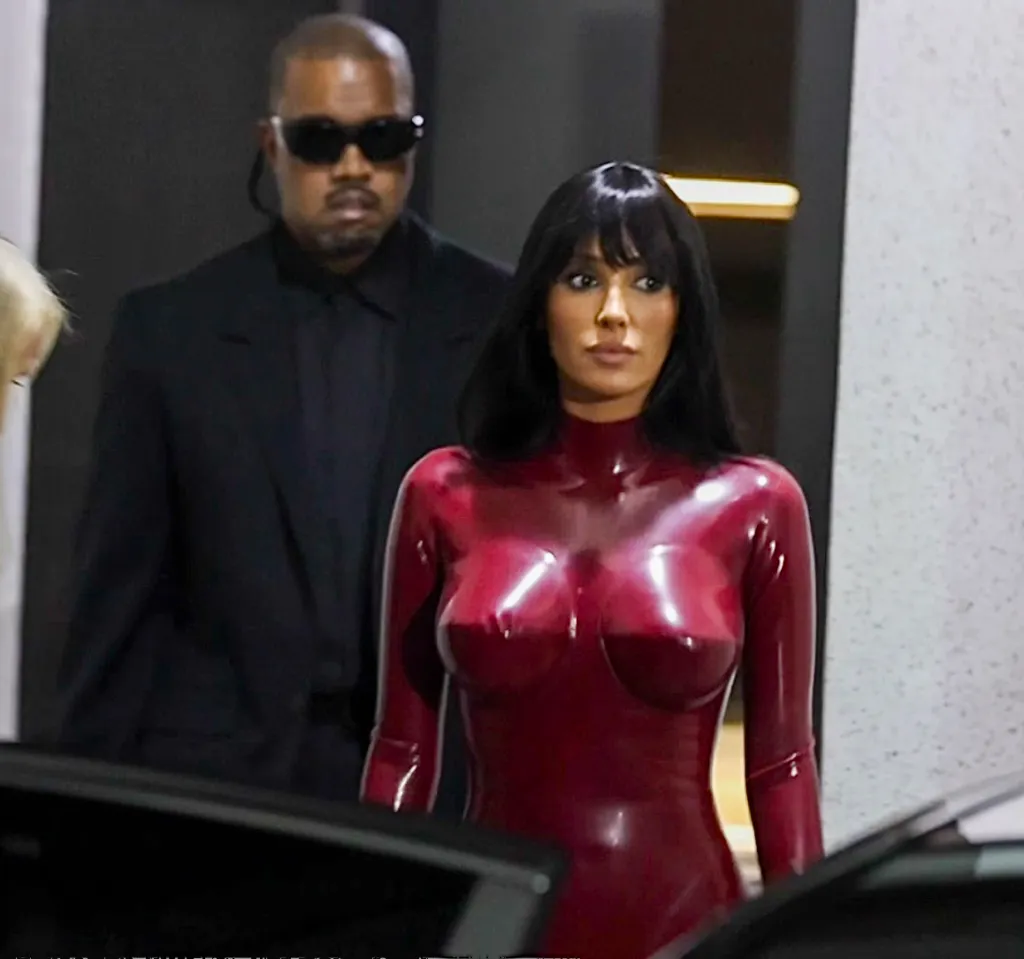 Bianca Censori in a red bodysuit with Kanye West in South Korea.
