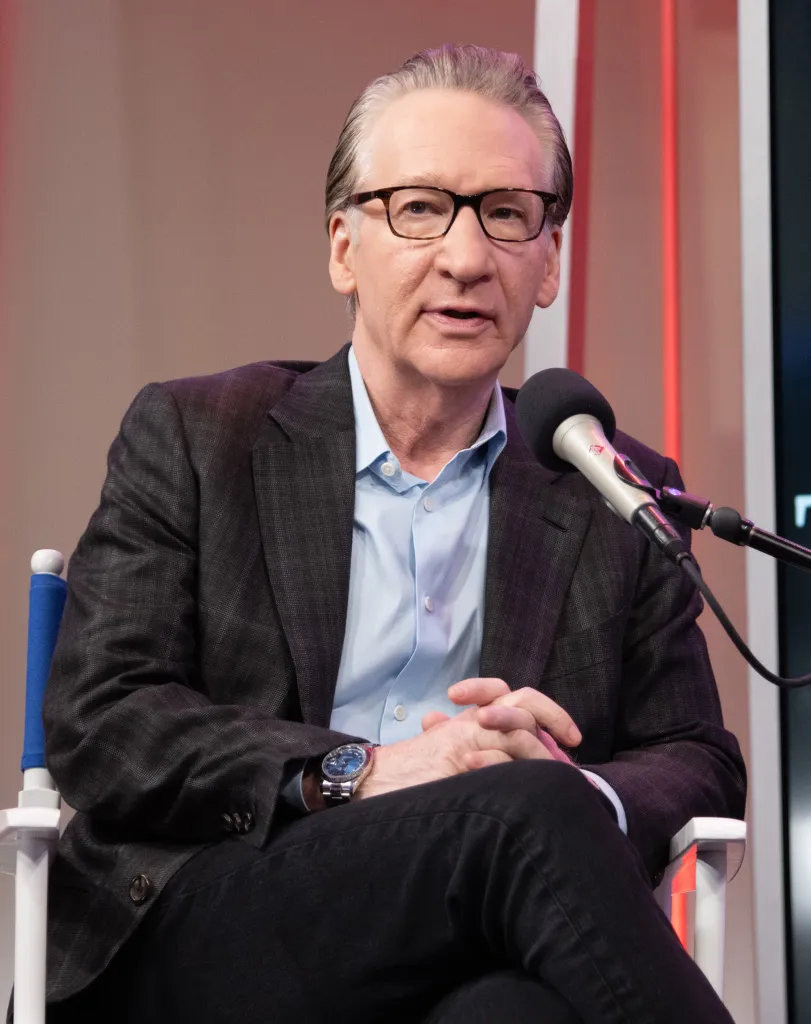 Bill Maher speaking into a microphone.