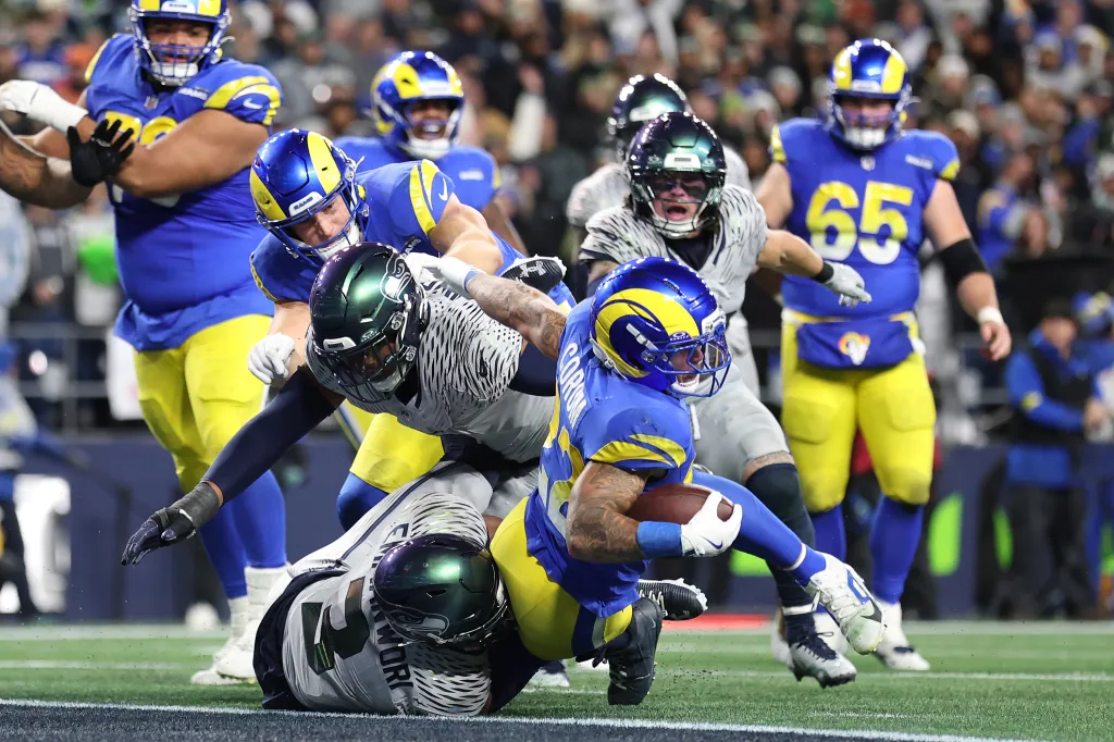 Blake Corum of the Los Angeles Rams scoring a third-quarter touchdown against the Seattle Seahawks.