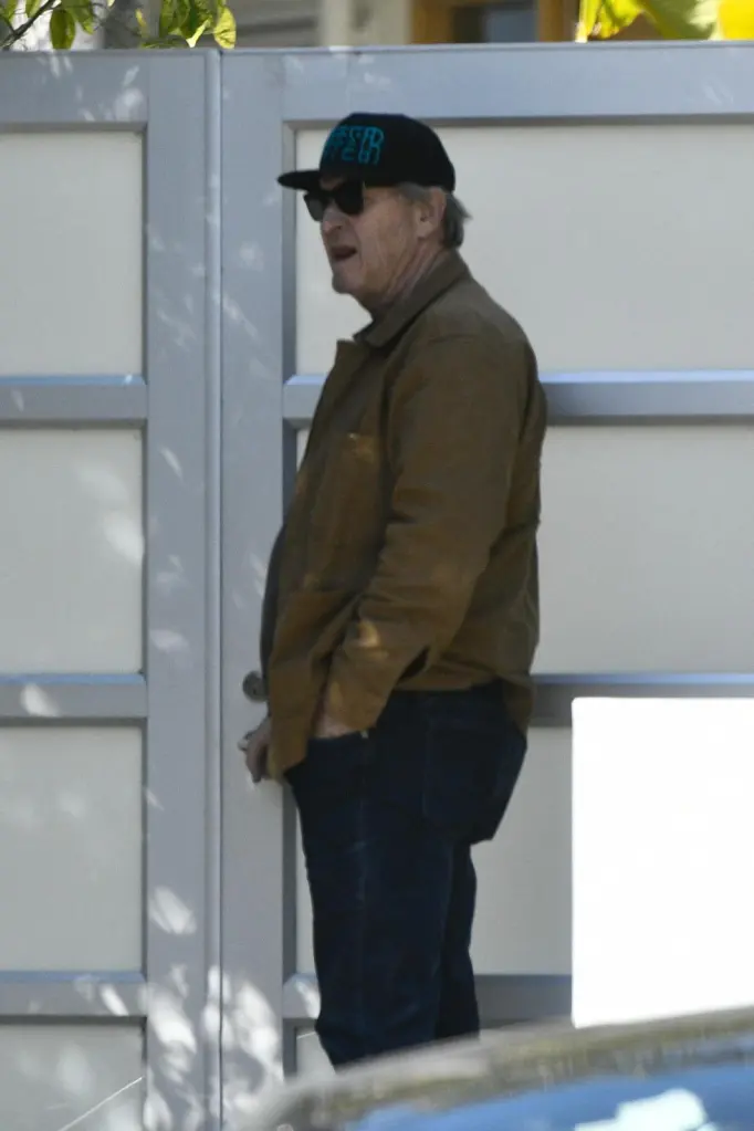 Brett Cullen standing in front of Catherine O'Hara's home.