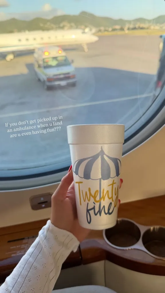 A woman holding a cup with 