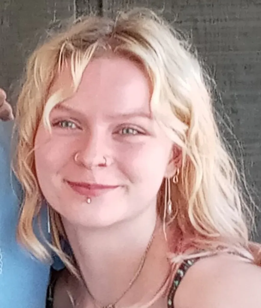 Caitlin Martin with long blonde hair, smiling.