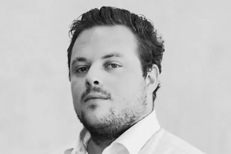 Black and white headshot of Cody Holmes.