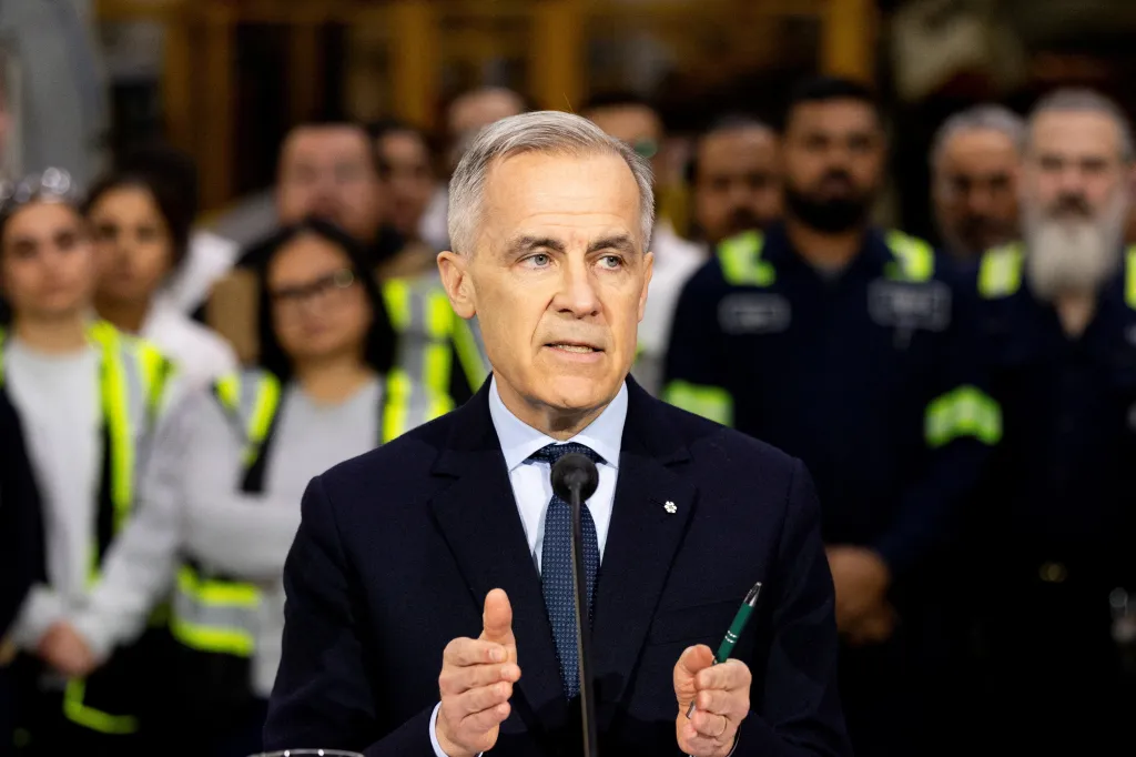 Canada's Prime Minister Mark Carney speaks to the media after touring an auto parts manufacturer.