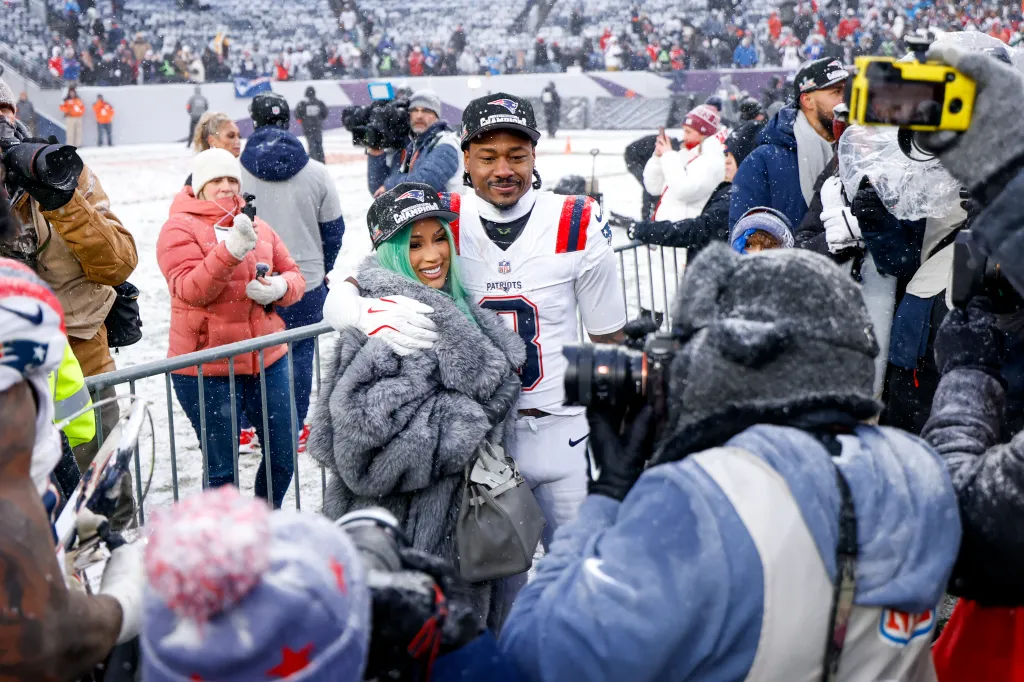 Cardi B and Stefon Diggs celebrate after the AFC Championship game.