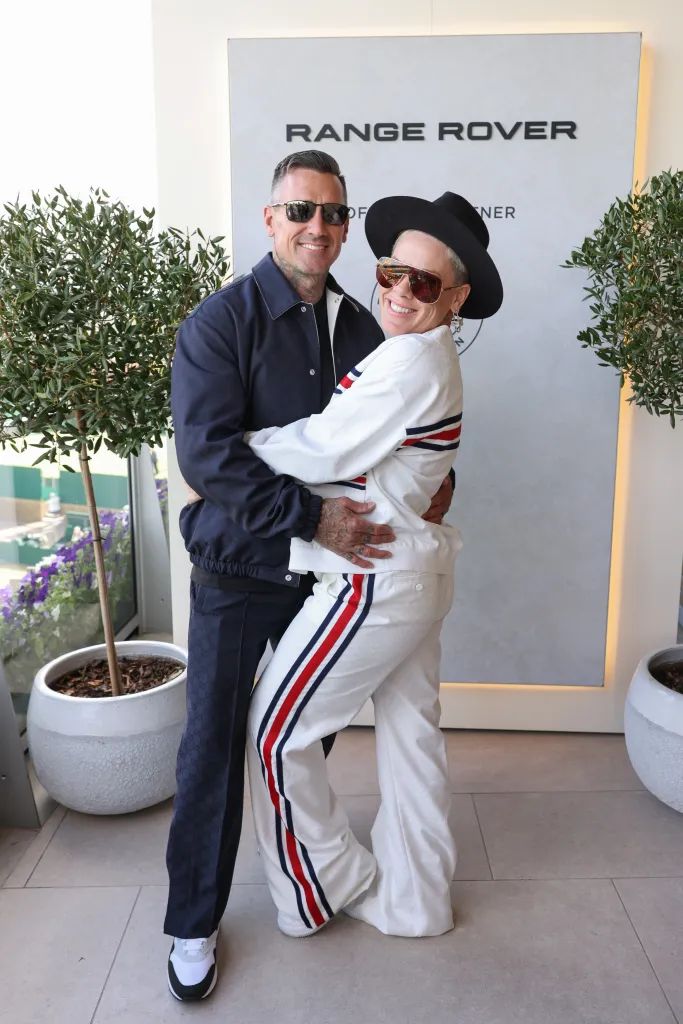 Carey Hart and Pink attend a celebratory lunch hosted by Range Rover and Harper's Bazaar.