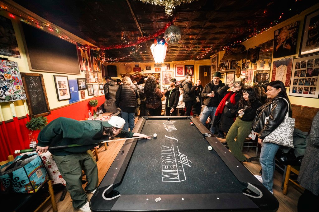 People playing pool at Caribbean Social Club.