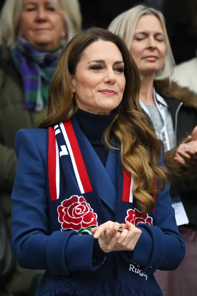 Catherine, Princess of Wales, wearing a navy coat and an RFU scarf.