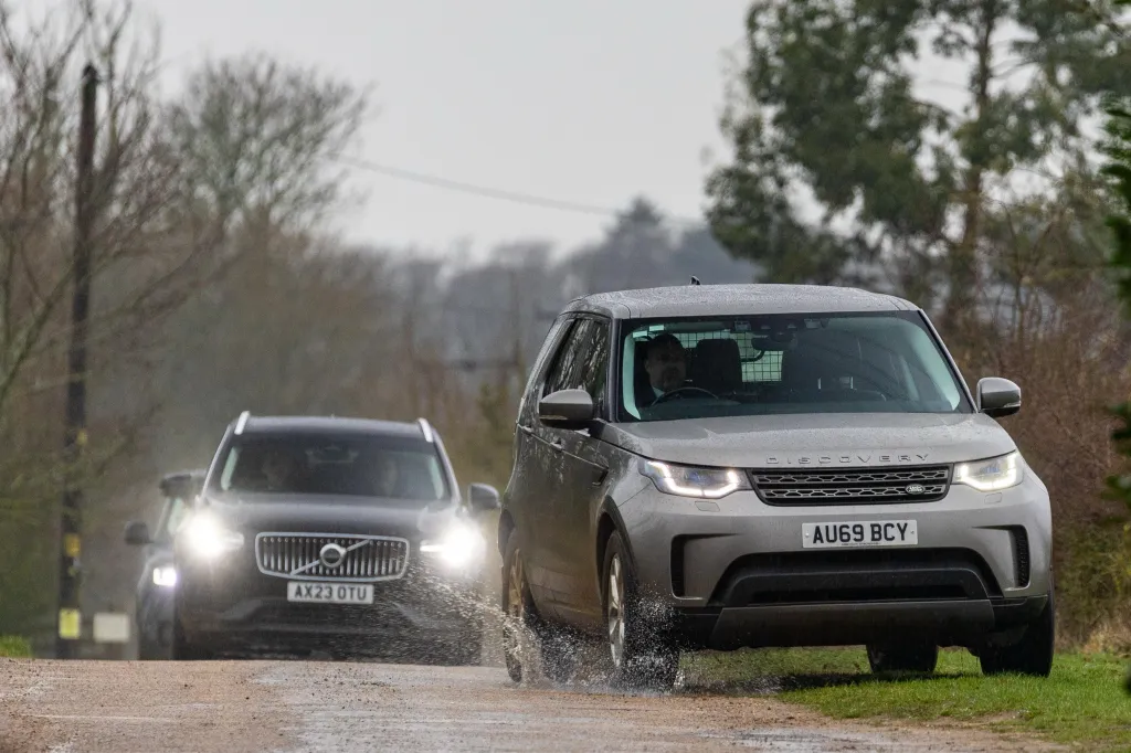 Unmarked police cars at Andrew Mountbatten Windsor's home during a police raid.