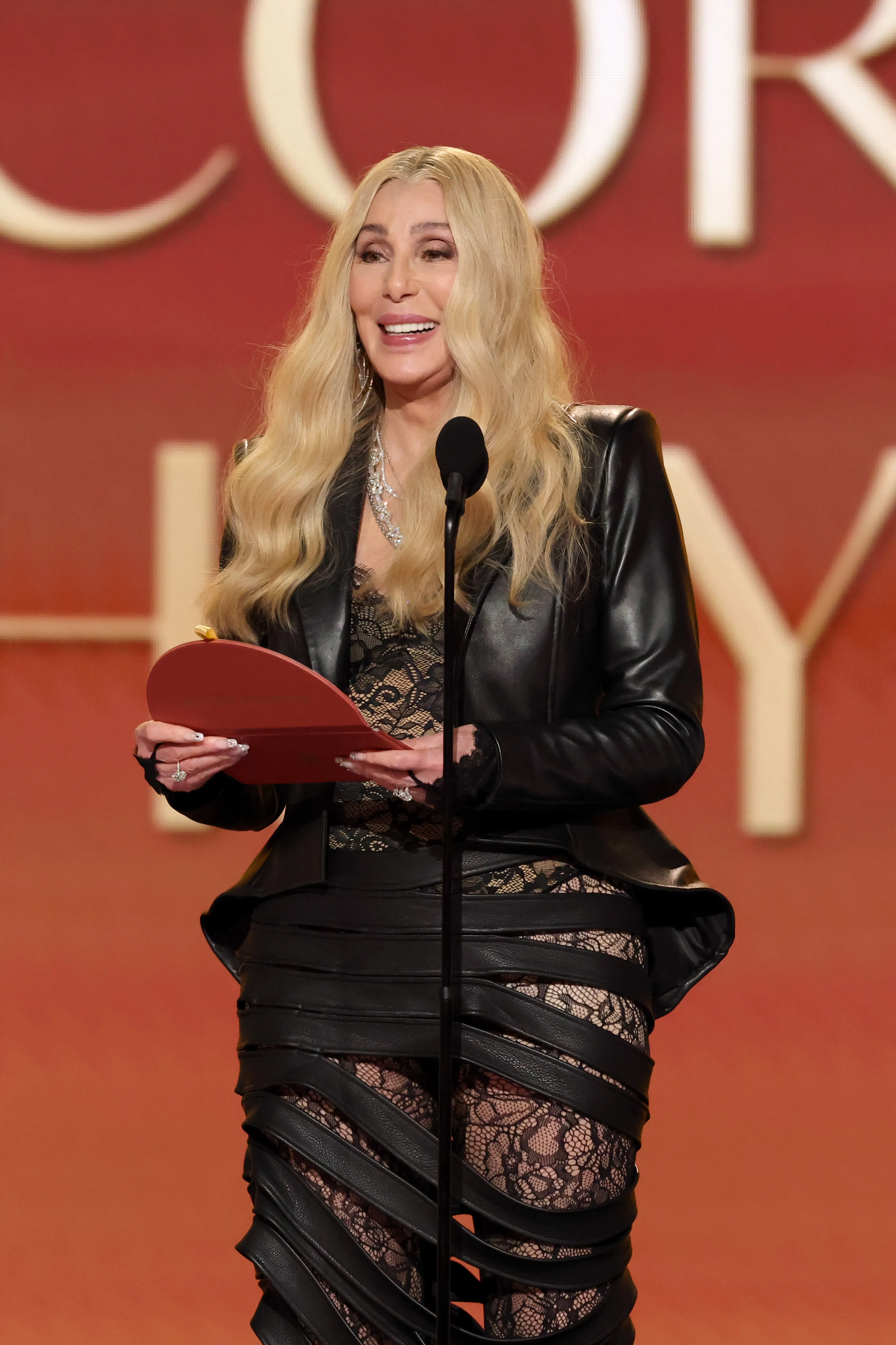 Cher speaking onstage at the 68th GRAMMY Awards.