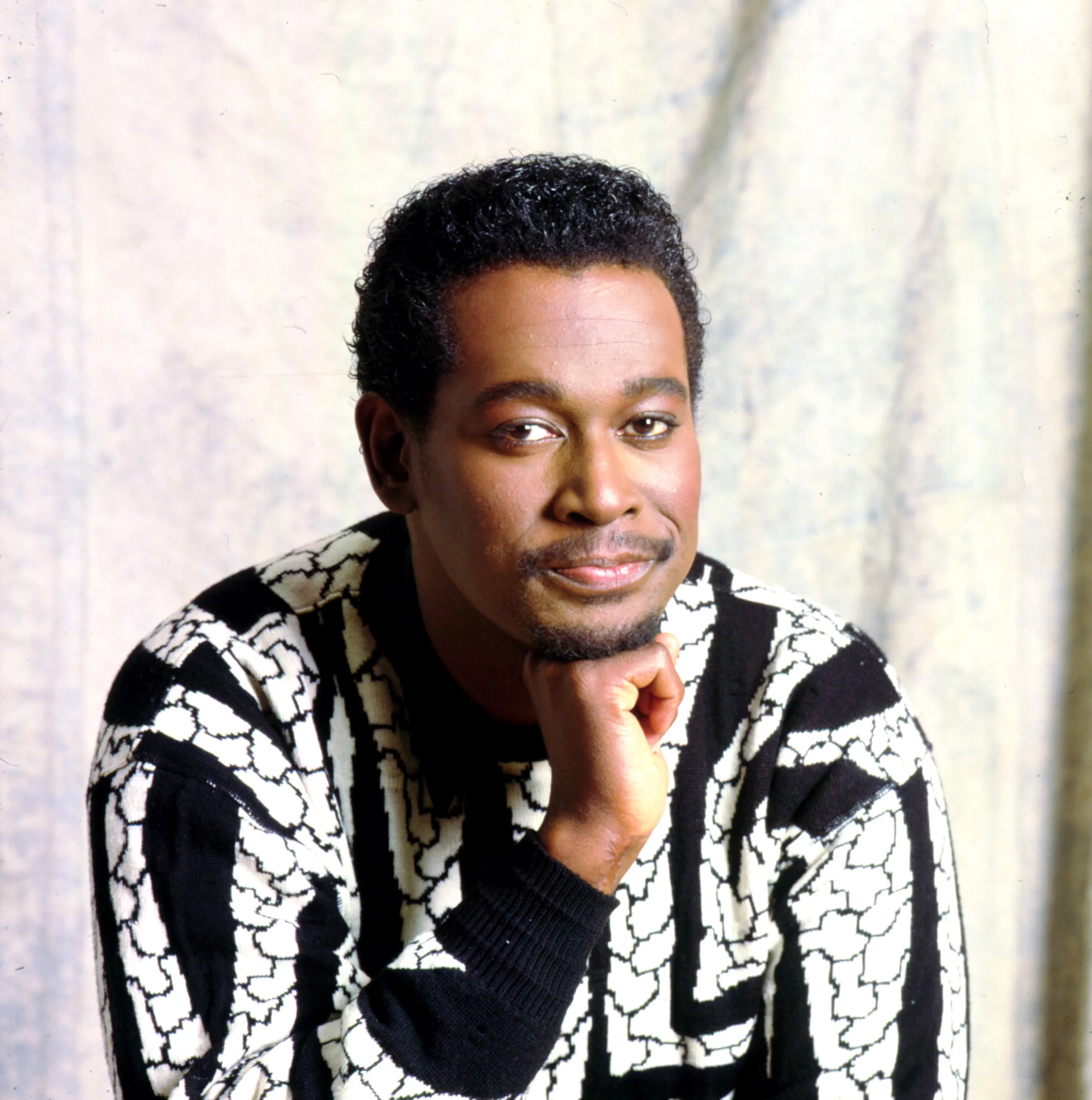 Portrait of Luther Vandross looking at the camera.