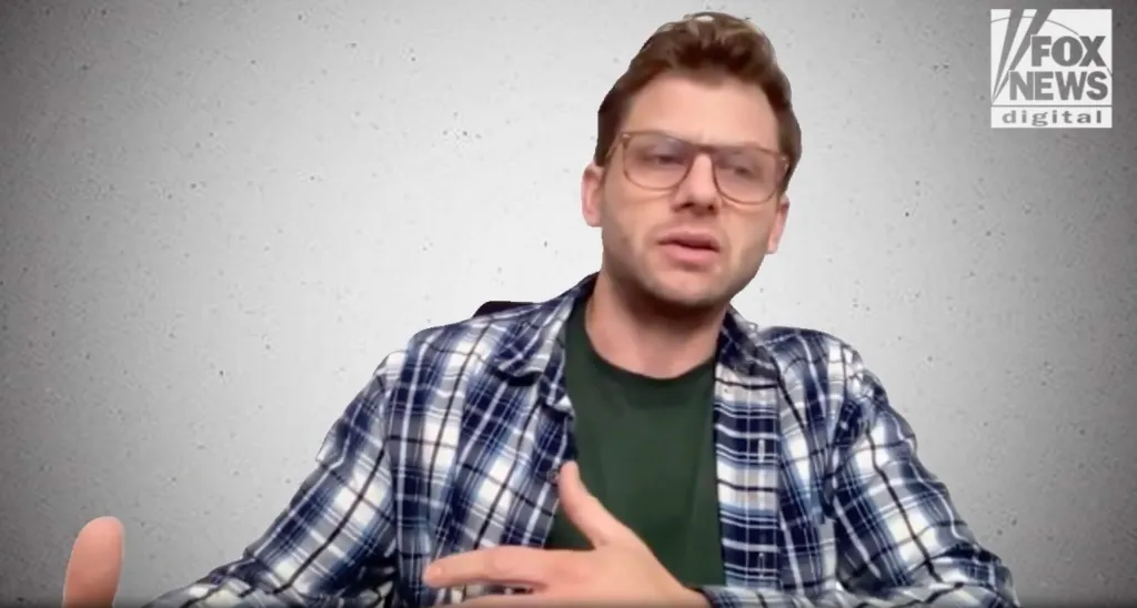 Comedian Charlie Behrens in glasses, green t-shirt, and blue plaid shirt speaking, with the Fox News Digital logo in the upper right.