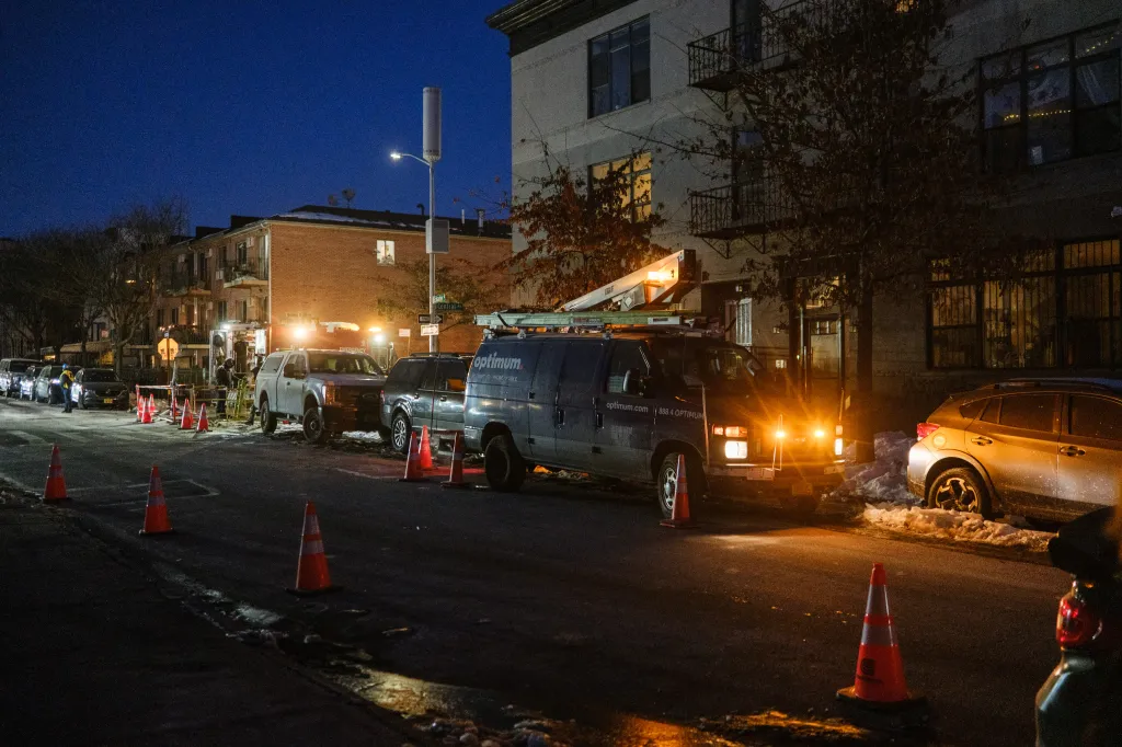 Emergency crews and an Optimum van working to restore power on a cold, dark street in Bushwick.