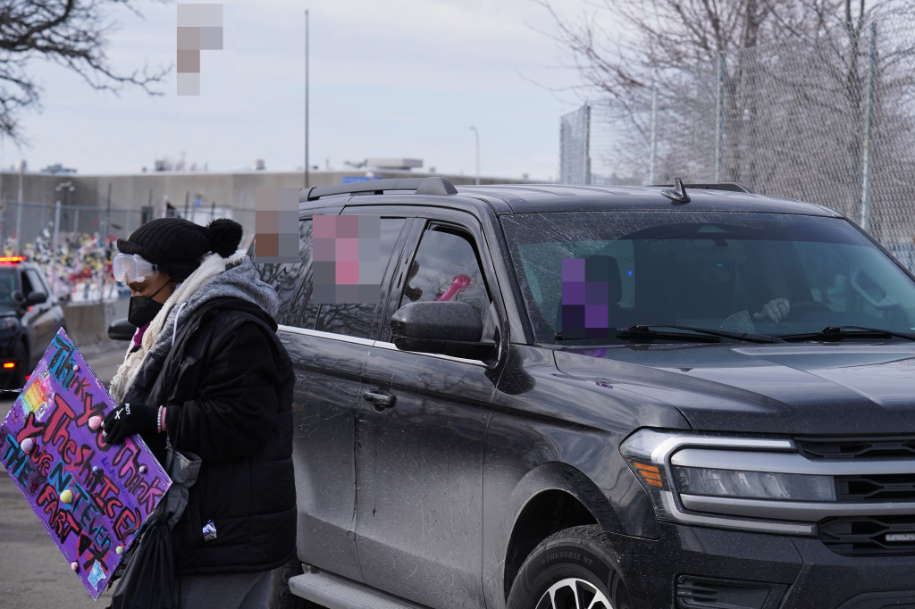 Protesters throw sex toys at a law enforcement vehicle as it drives near the Bishop Henry Whipple Federal Building on Feb. 7, 2026. 