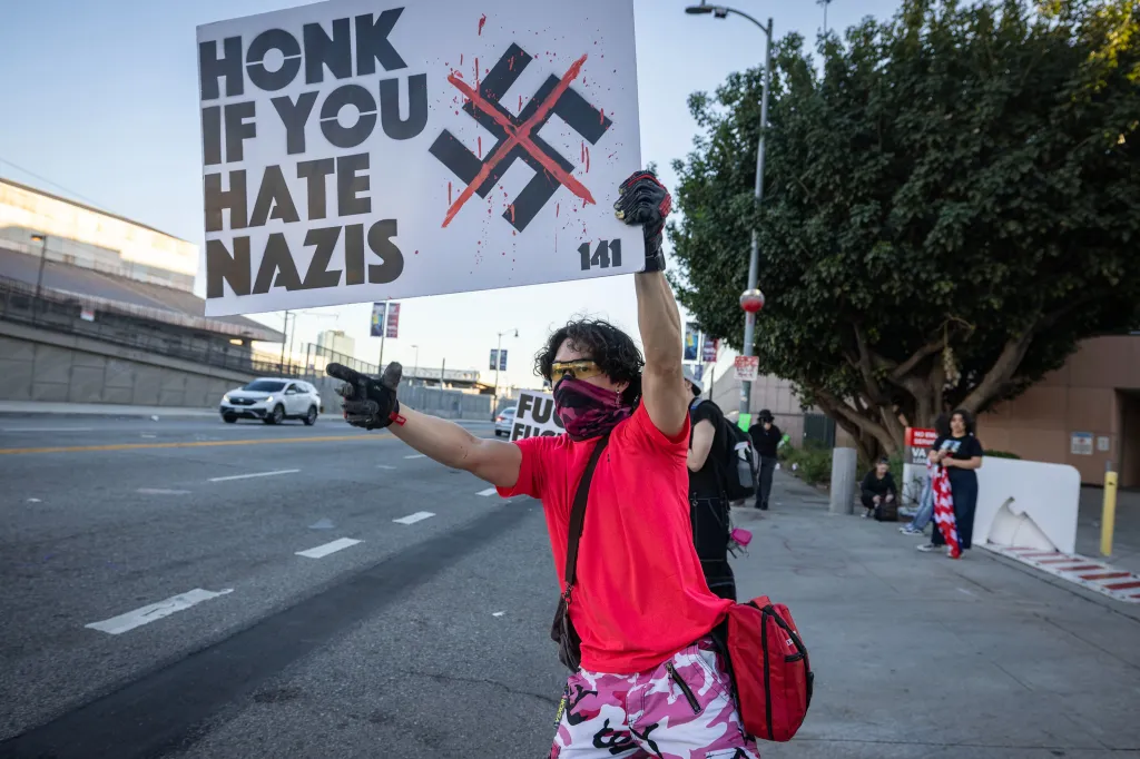 Protester holding a sign that reads
