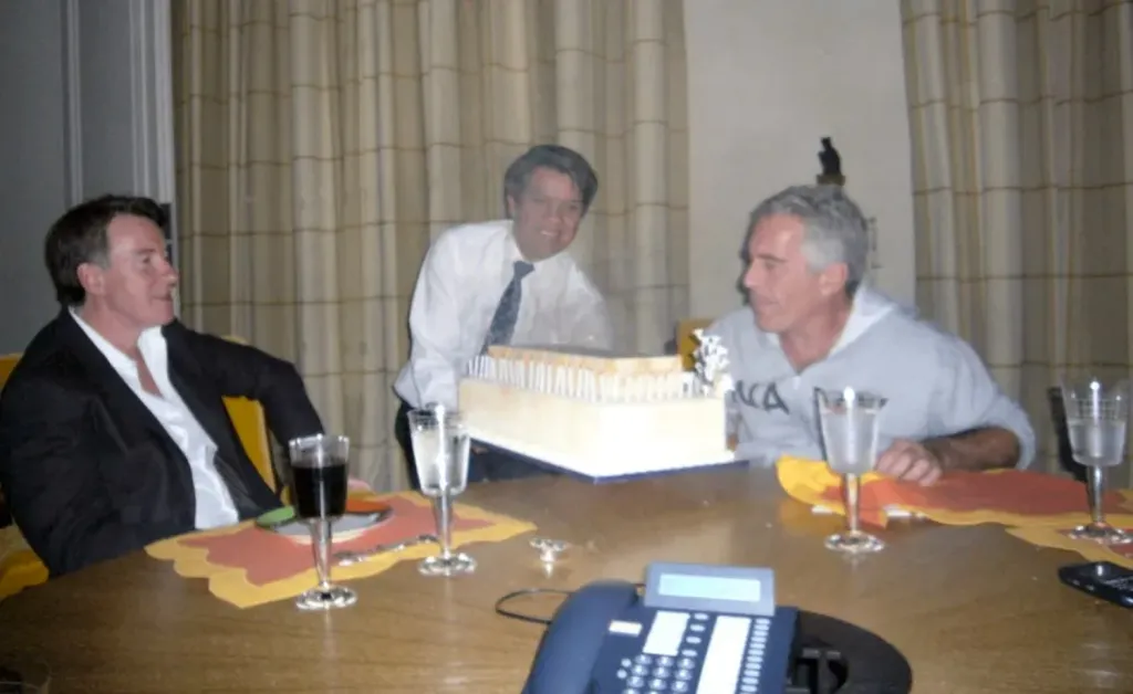 Peter Mandelson and Jeffrey Epstein celebrating a birthday in a photo released by the Justice Department.