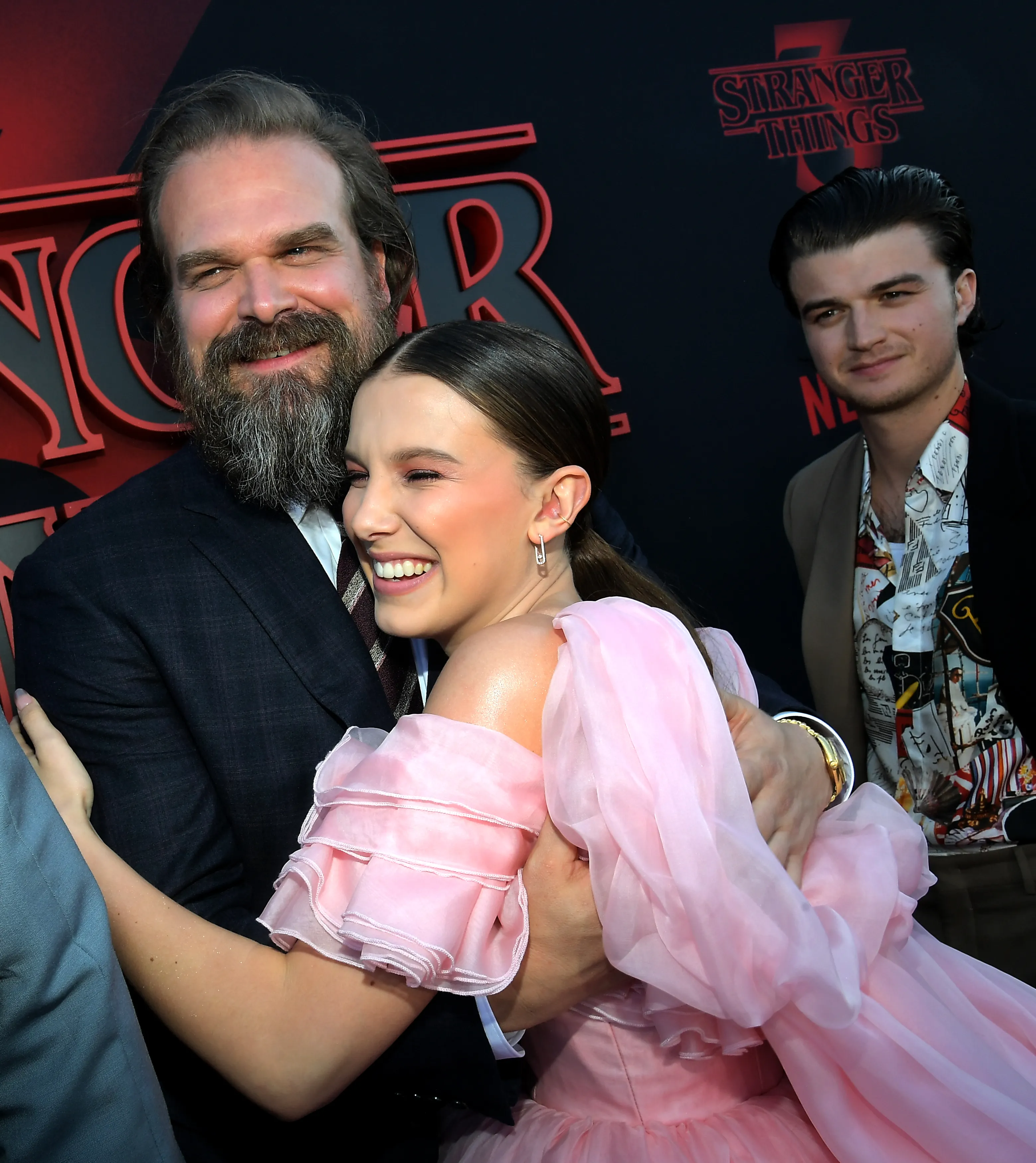 David Harbour and Millie Bobby Brown embrace at the 
