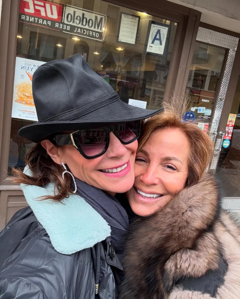 Luann de Lesseps and Jill Zarin smiling and hugging.