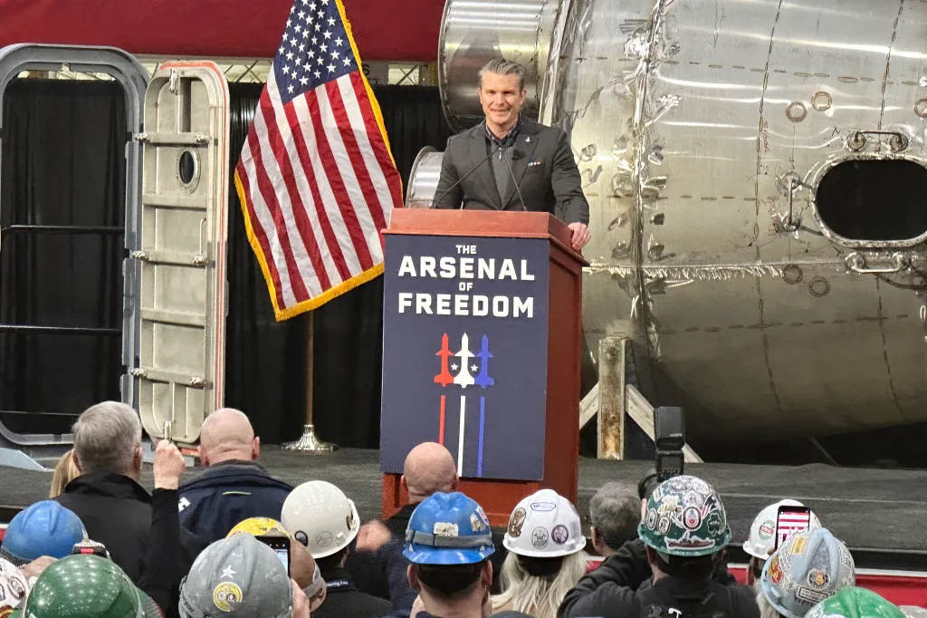 Defense Secretary Pete Hegseth speaks at the Bath Iron Works in Bath, Maine.