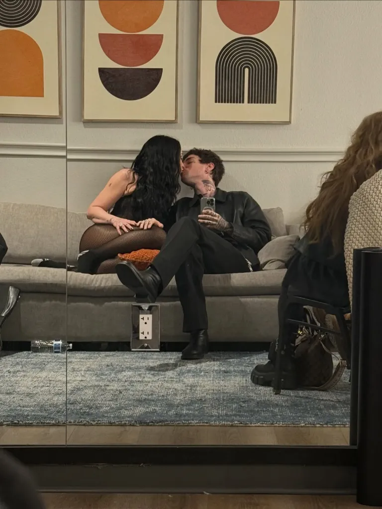 Demi Lovato and Jutes kissing on a sofa.