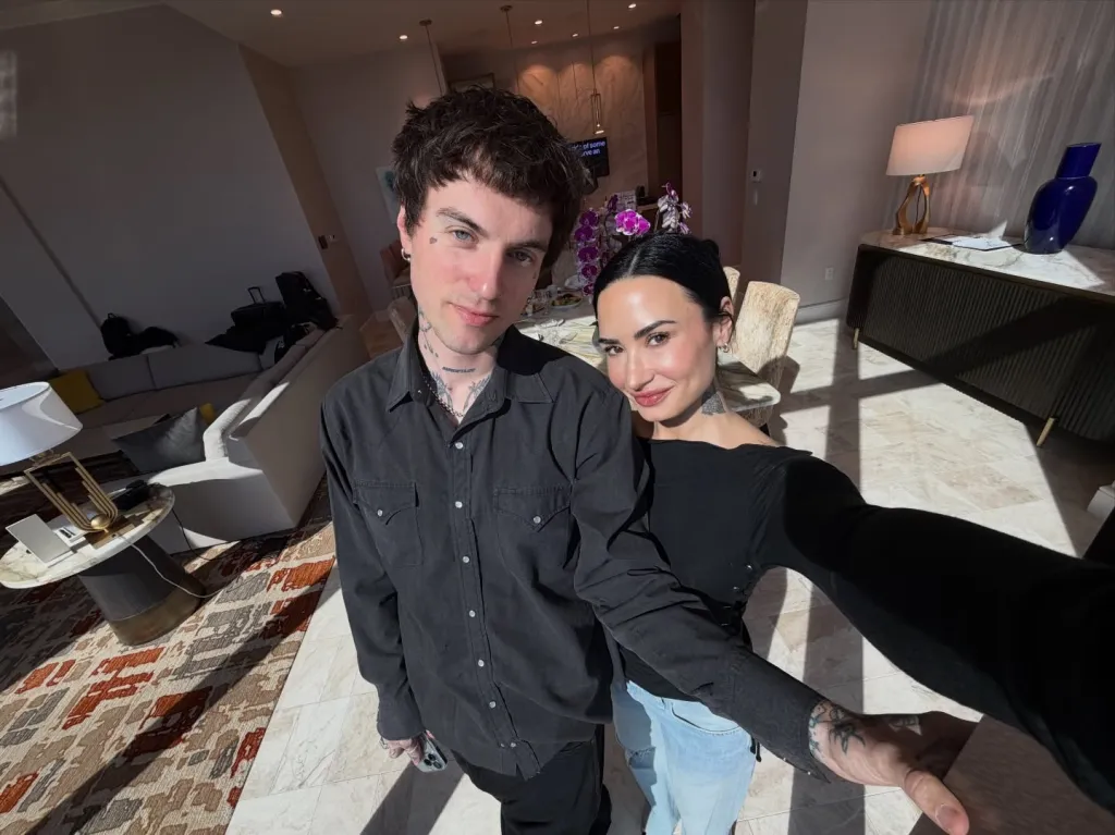 Demi Lovato and Jutes posing together for a selfie.