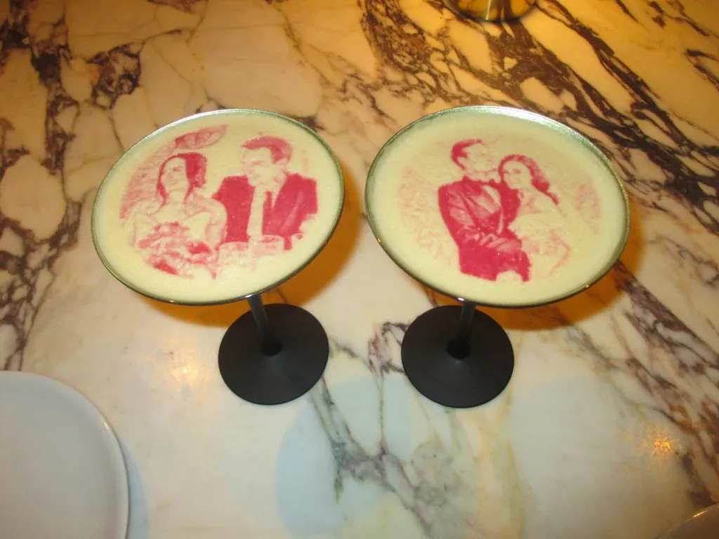 Two cocktails with red images of Demi Lovato and Jutes on the foam.