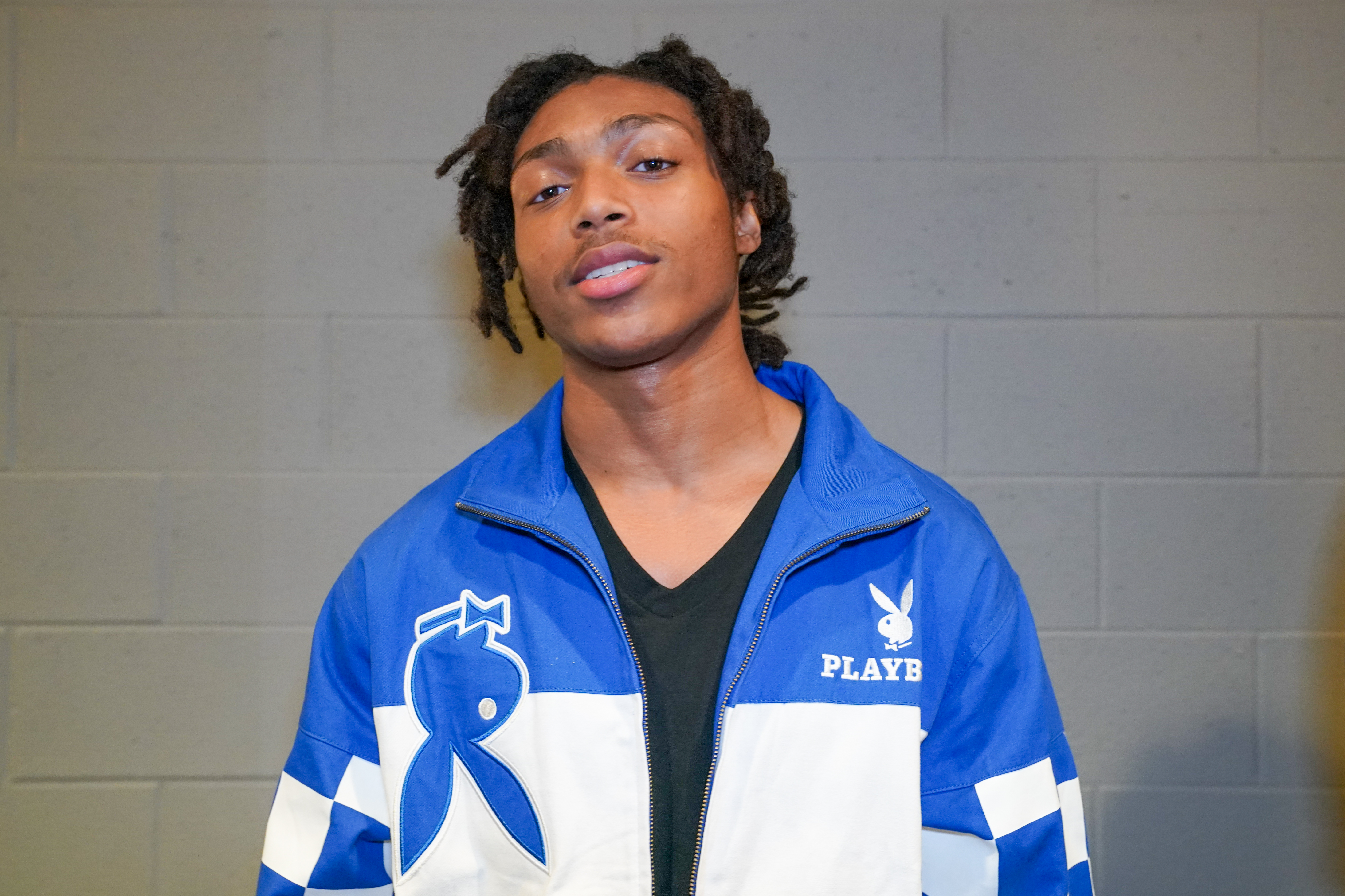 DJ Young Slade in a blue and white Playboy jacket.