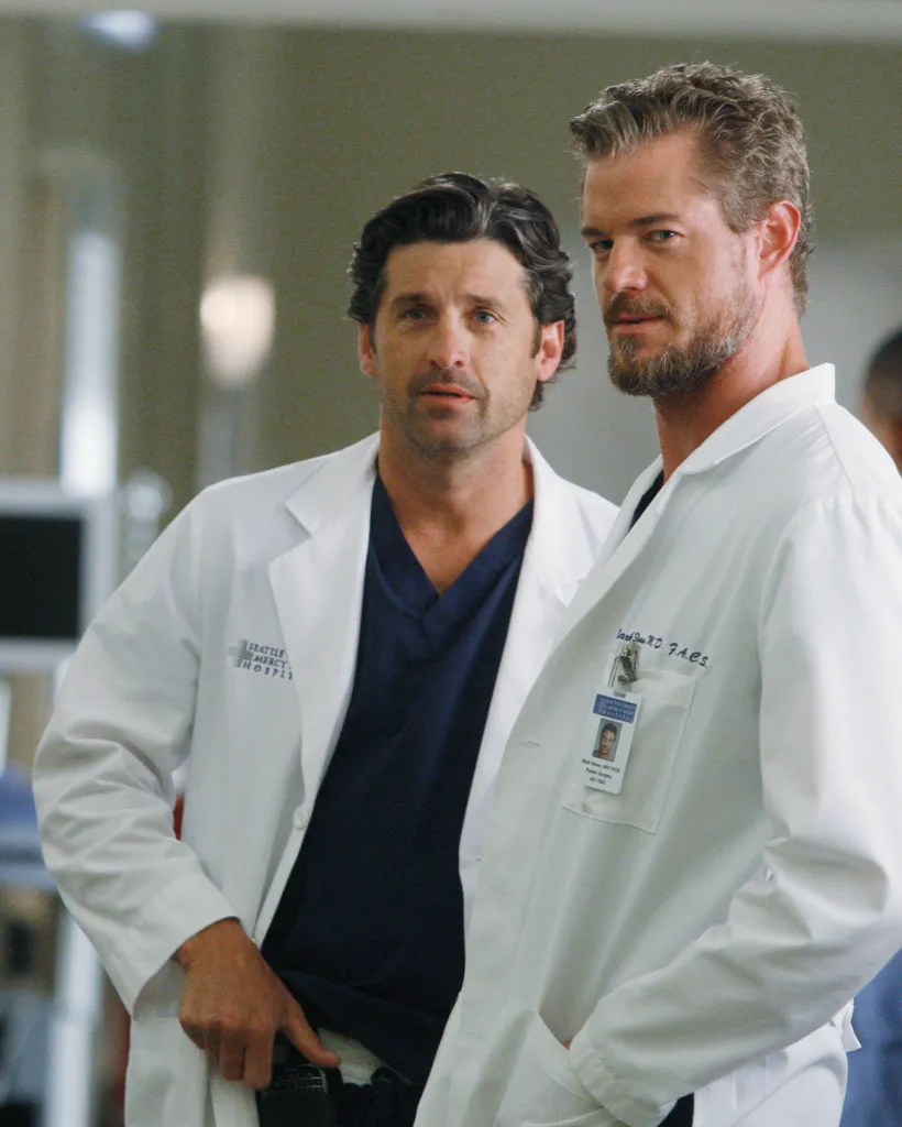 Patrick Dempsey and Eric Dane as doctors in lab coats.