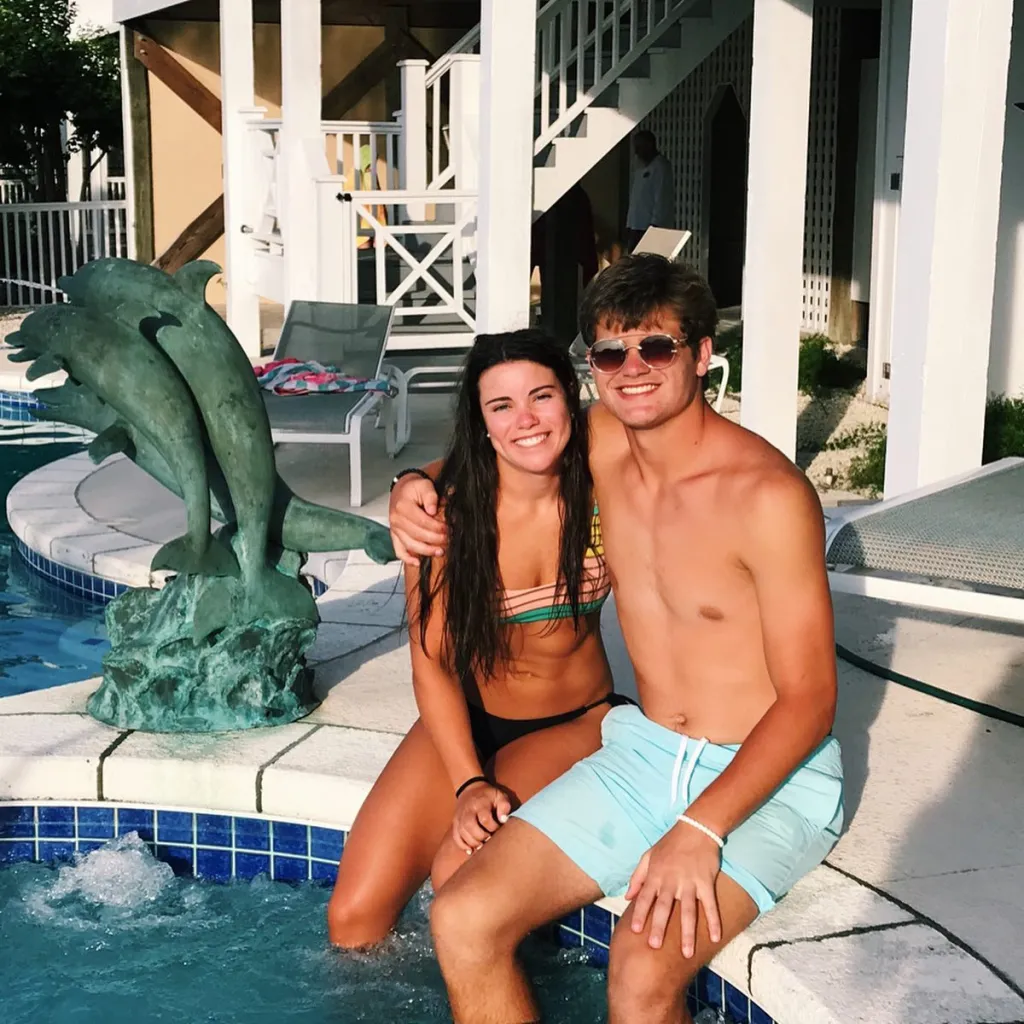 Drake Maye and Ann Michael Maye smiling by a pool.