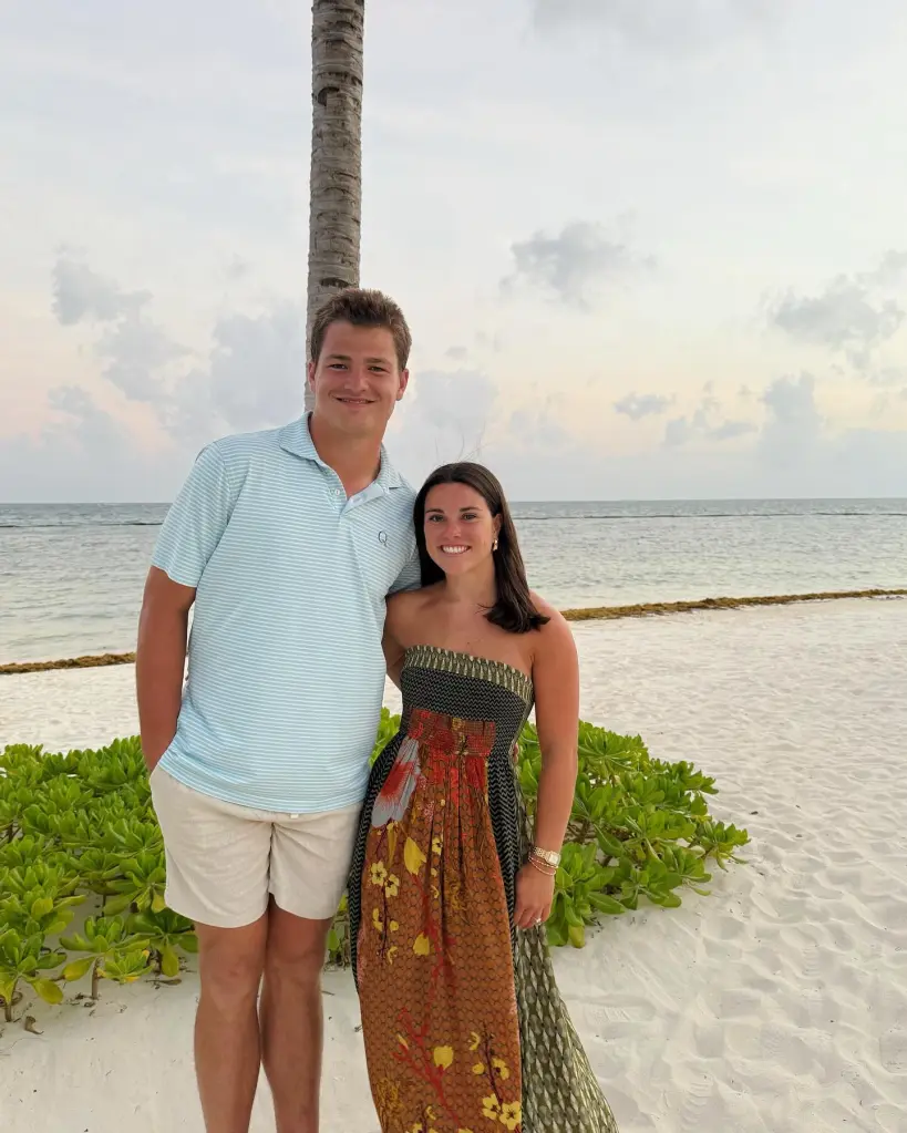 Drake Maye and Ann Michael Maye standing on a sandy beach.