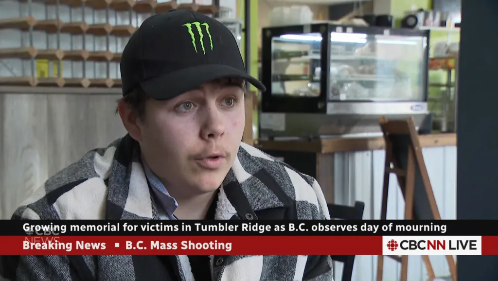 Duncan McKay, a survivor of a mass shooting, wearing a black cap and plaid jacket.