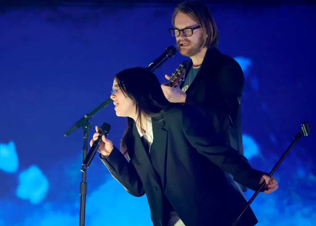 Billie Eilish and FINNEAS perform at the 2025 iHeartRadio Music Awards.