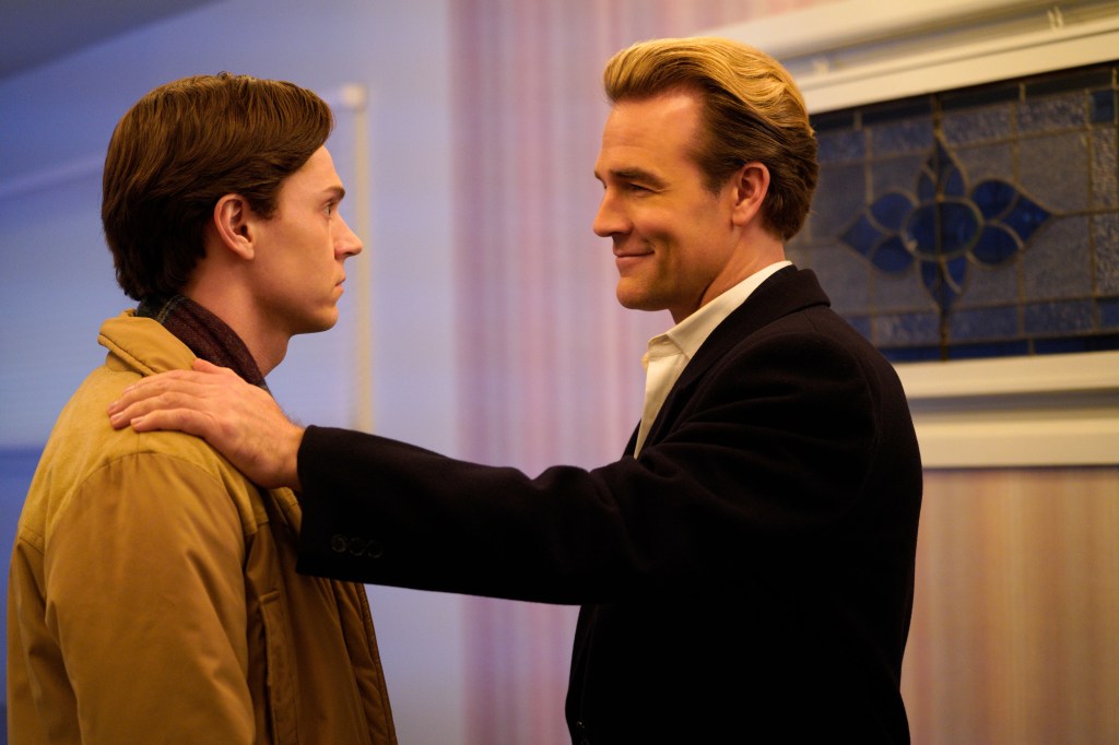 James Van Der Beek places a hand on Evan Peters' shoulder as they both look right, Van Der Beek smiling.