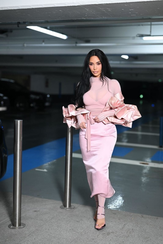Kim Kardashian in Paris wearing a pink Skims x Nike outfit.