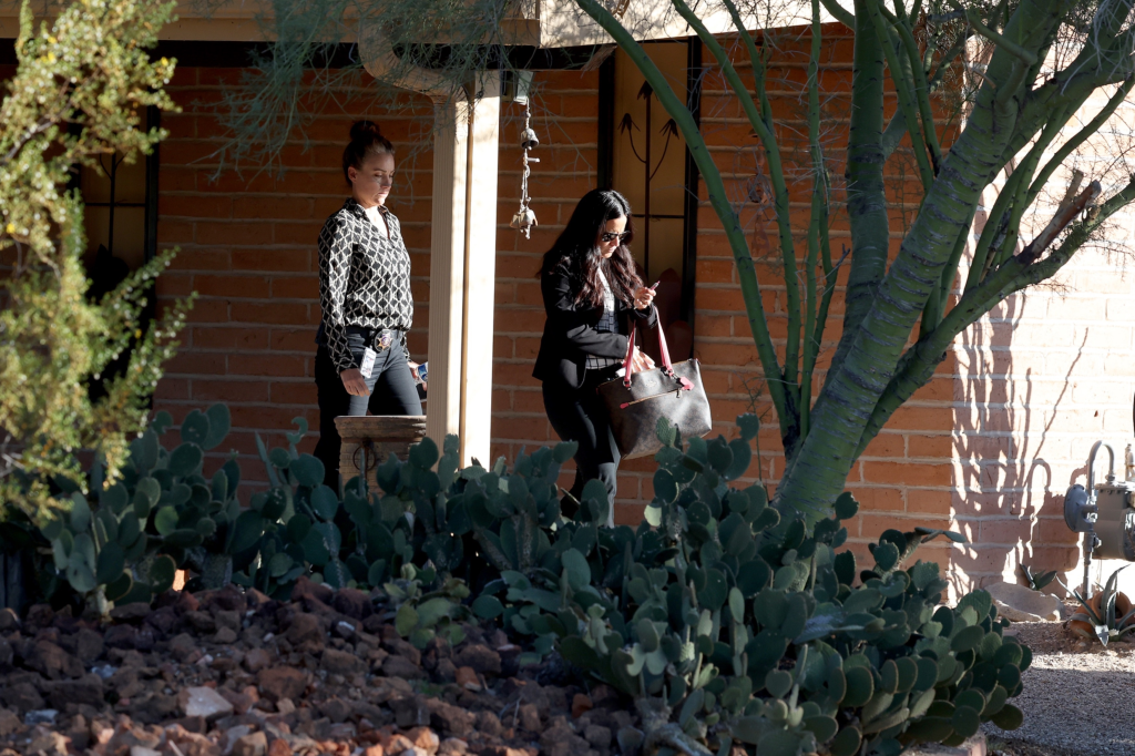 Two women leave Savannah Guthrie's sister Annie's Tucson home.