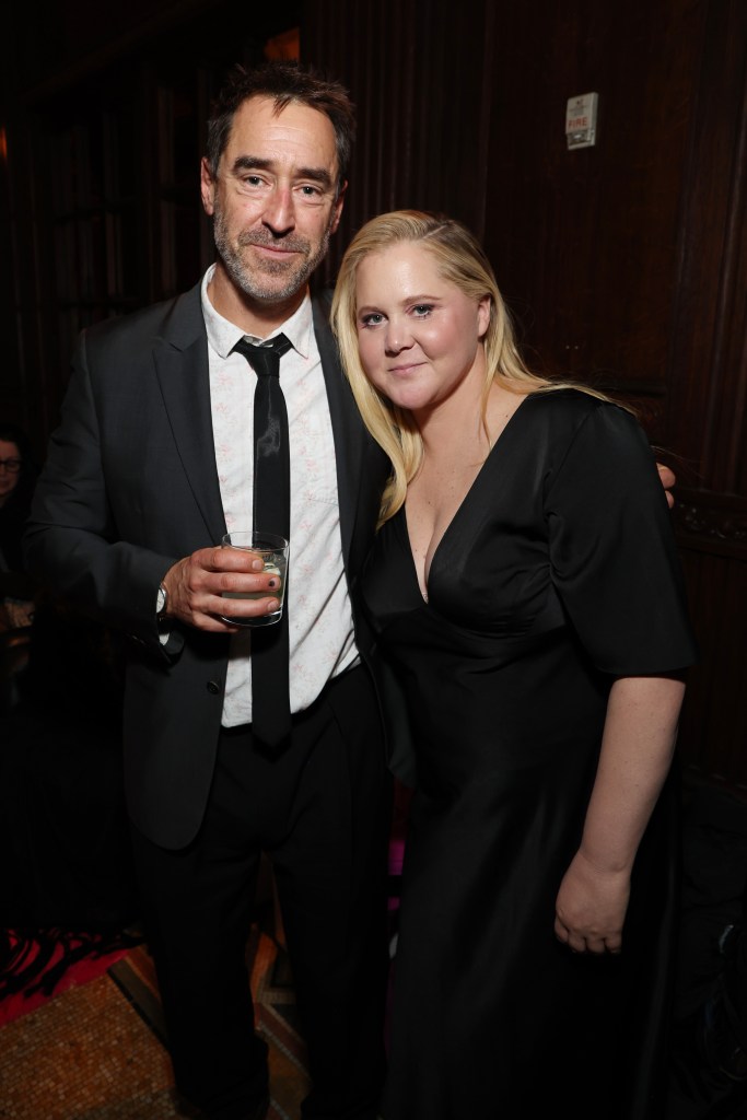 Chris Fischer and Amy Schumer attending the 