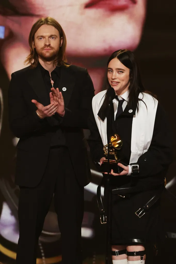 Finneas O'Connell and Billie Eilish accepting the Song of the Year award.