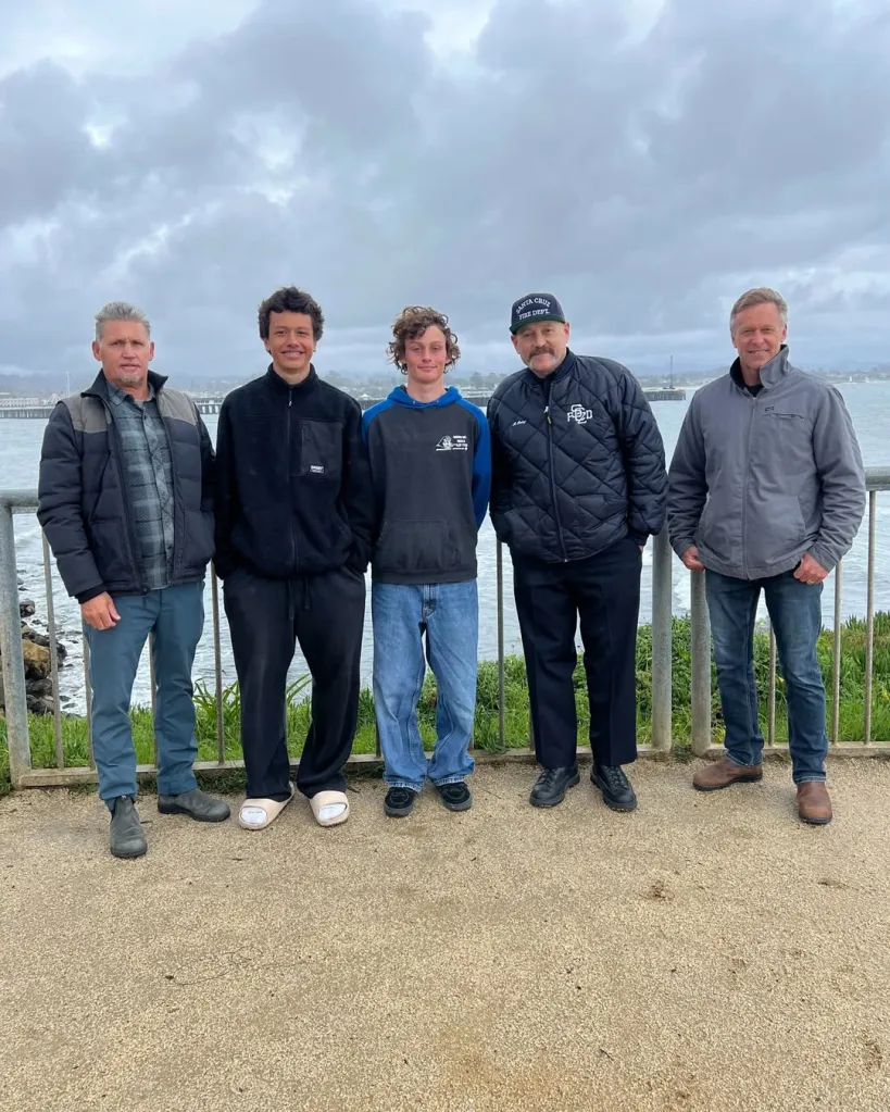 Fire Chief Rob Oatey and four surfers who helped rescue boat accident victims.