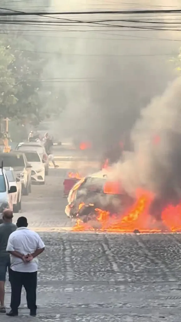 A car on fire in the streets of Puerto Vallarta, Mexico.