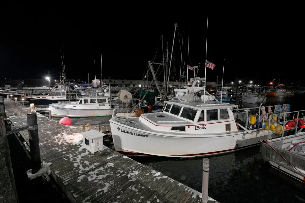 Fishing boats tied up in Gloucester, Massachusetts, during winter.