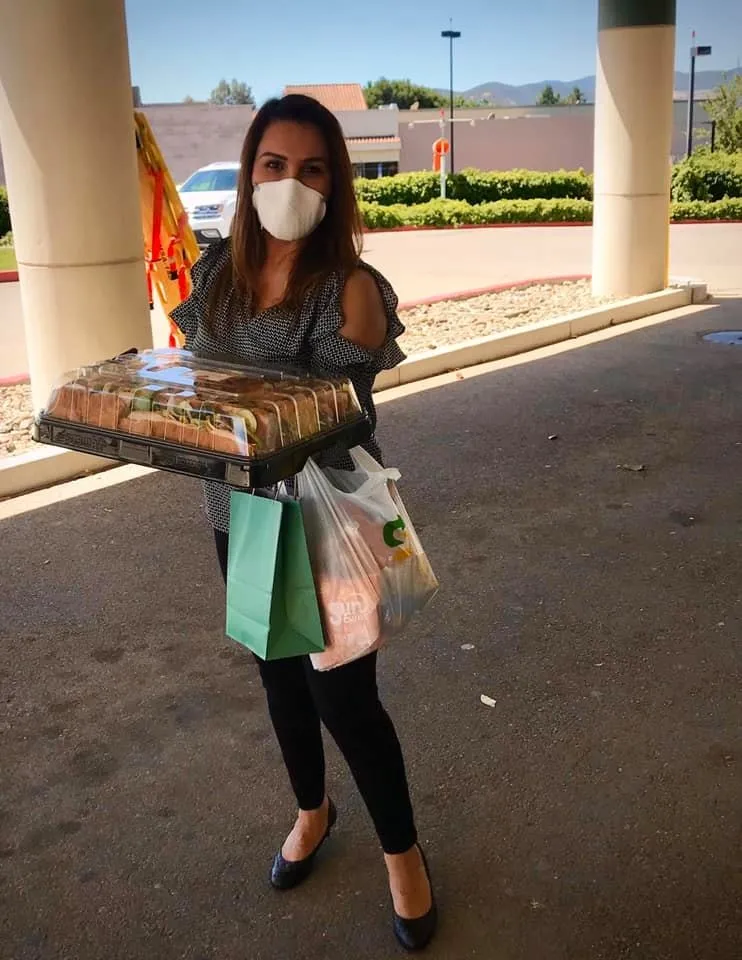 Flor Mora, owner of Fountain Hospice, delivering lunch to ER and SNF departments at Mee Memorial Healthcare System.